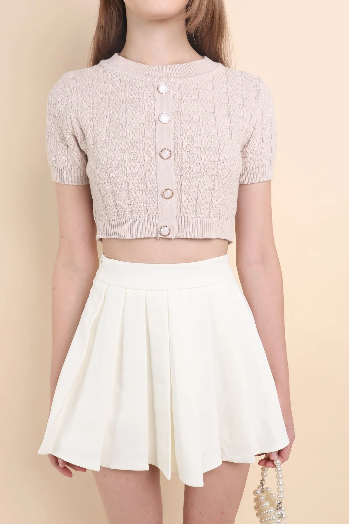 CAMU PLEATED SKIRT IN CREAM WHITE