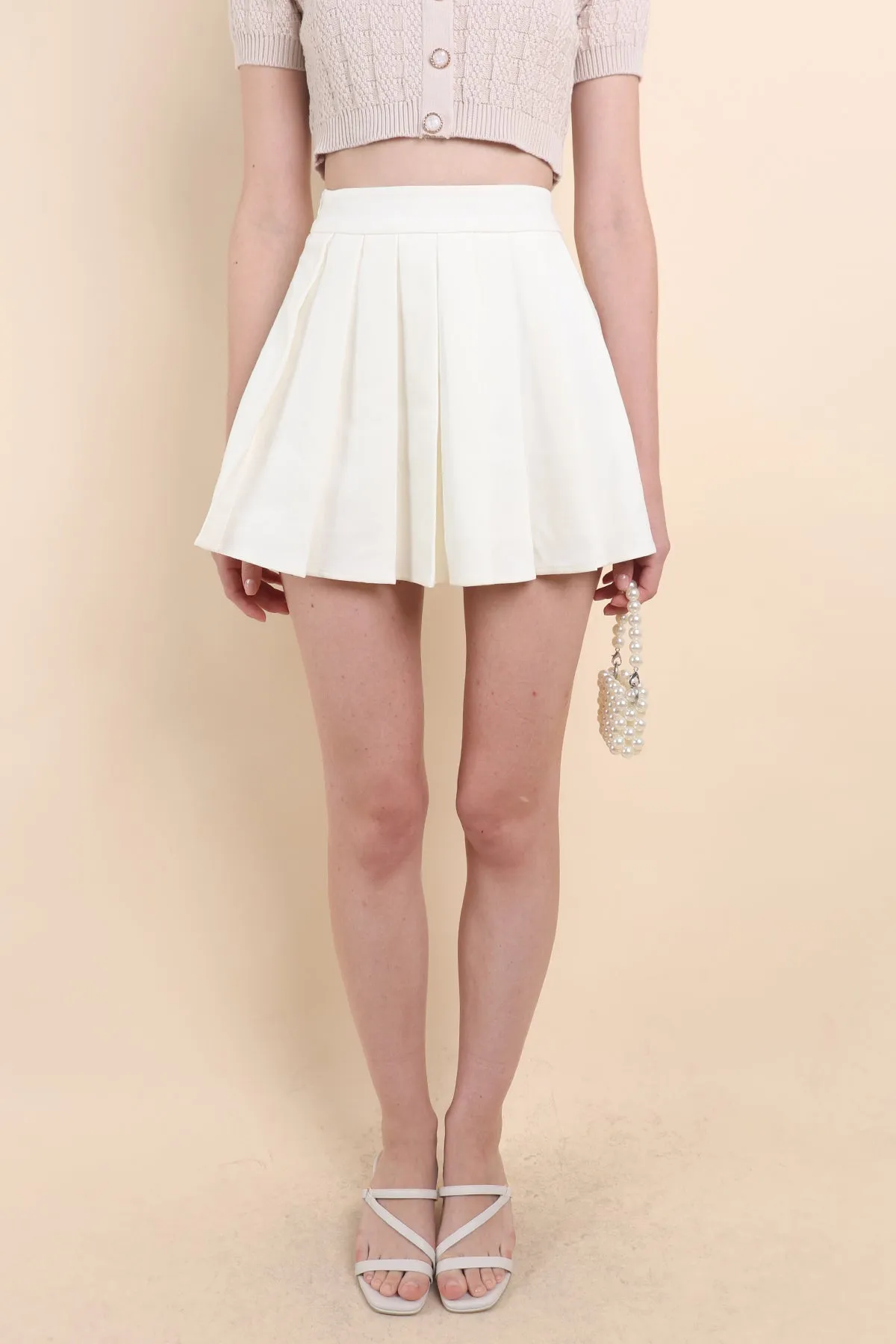 CAMU PLEATED SKIRT IN CREAM WHITE