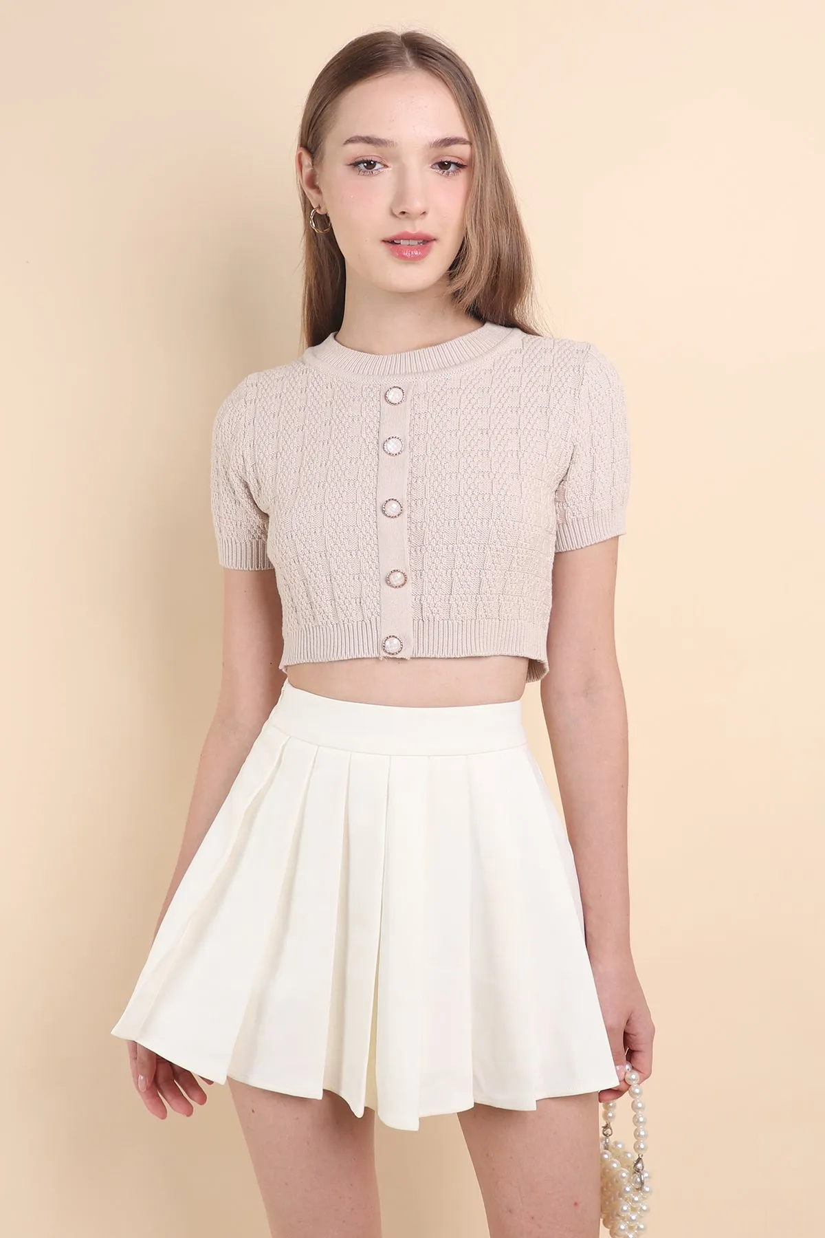 CAMU PLEATED SKIRT IN CREAM WHITE