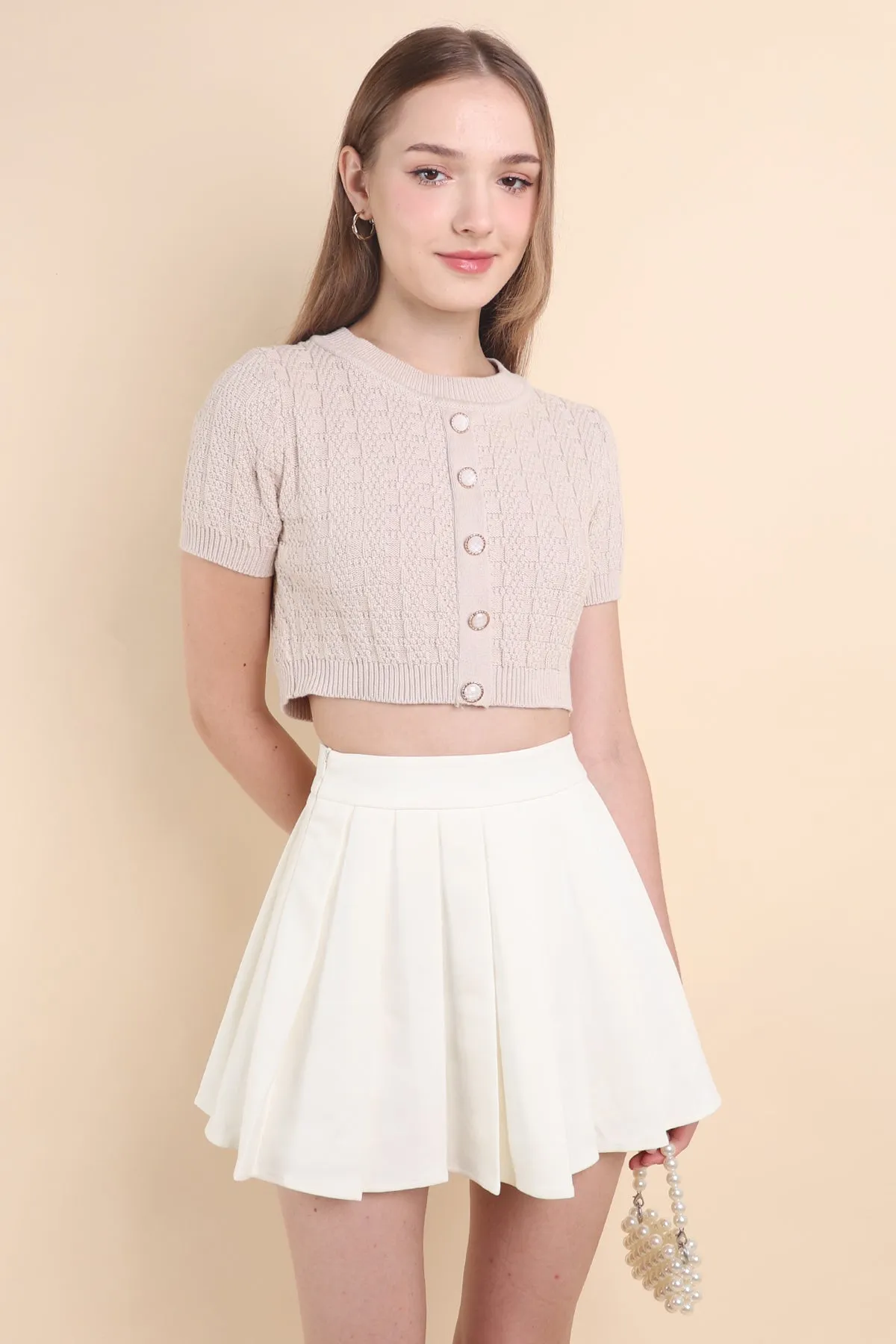 CAMU PLEATED SKIRT IN CREAM WHITE